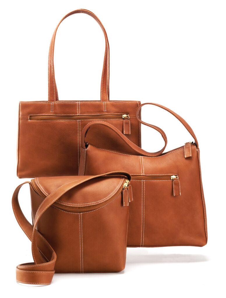 Hobo brown leather handbags on white background
