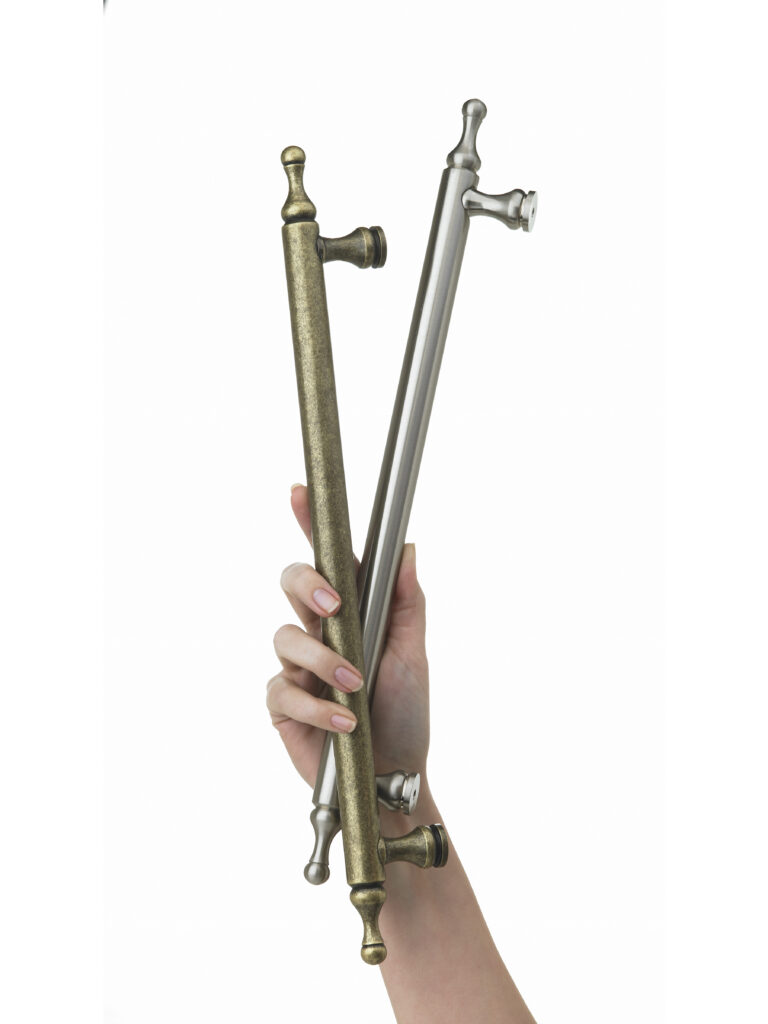 Amerock Appliance pulls held like a bouquet in hand on white