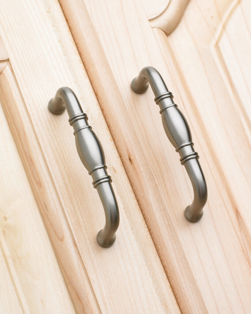 Amerock pulls on light wood cabinet doors
