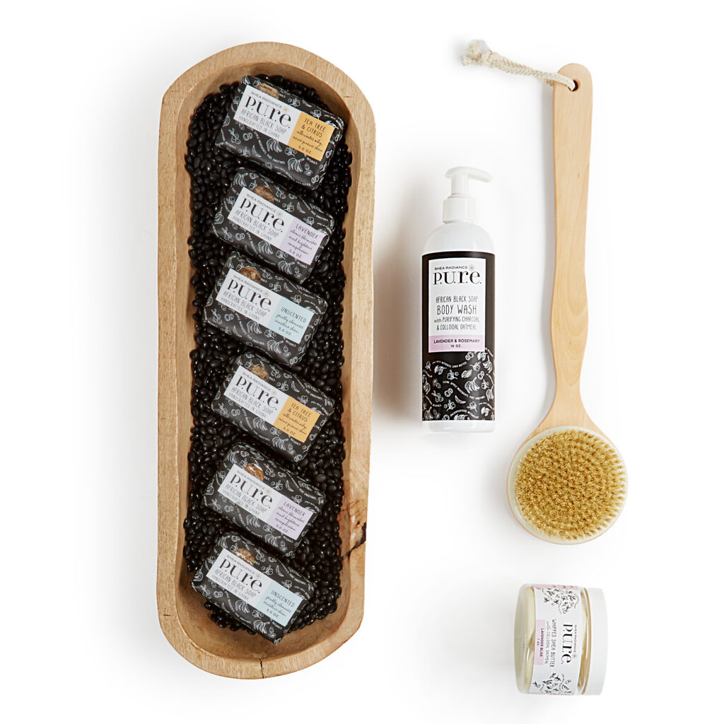 Shea Radiance black soaps and body brush on white background