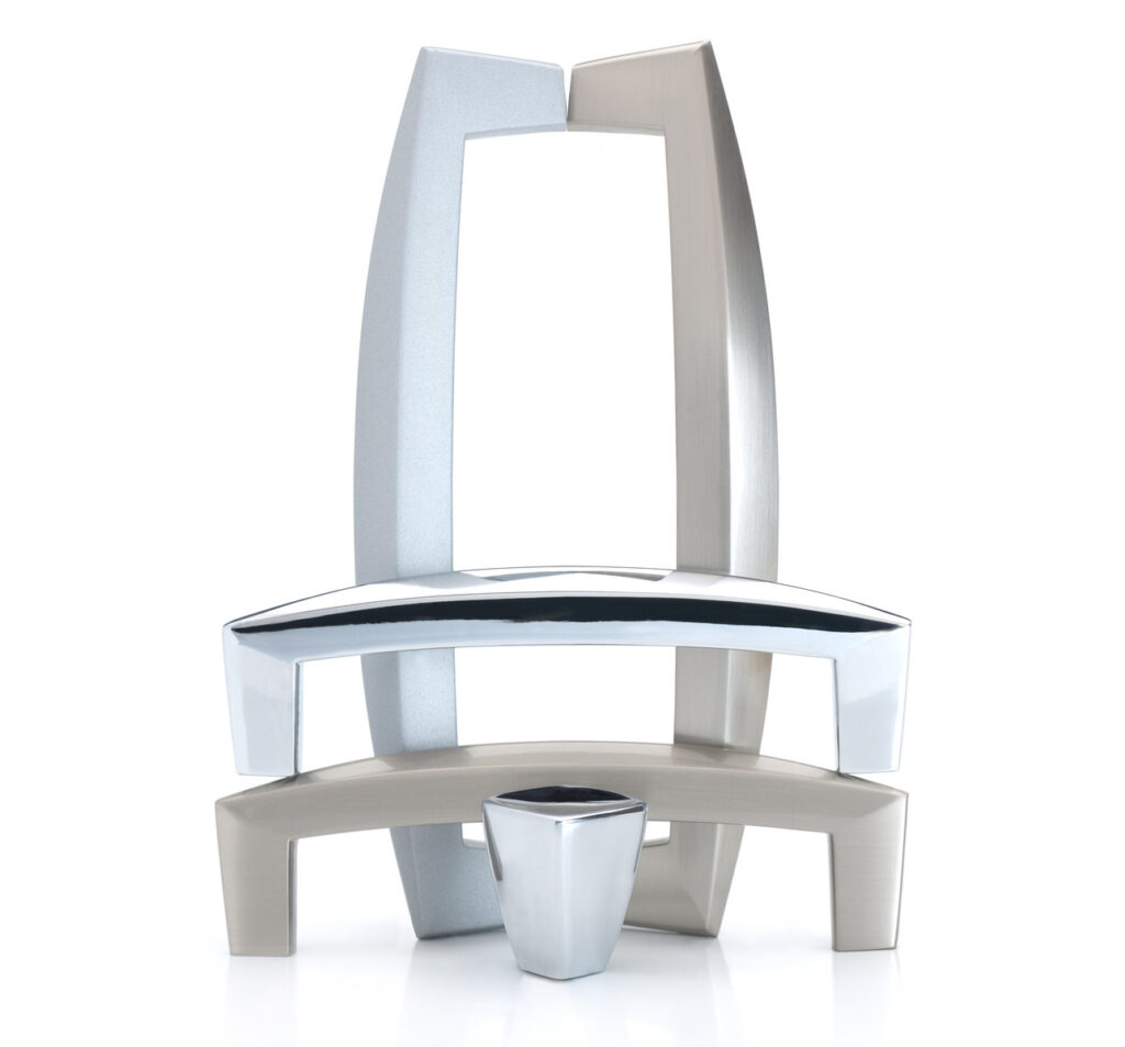 Amerock Creased Bow polished chrome and satin nickel hardware arranged as sculpture on white background