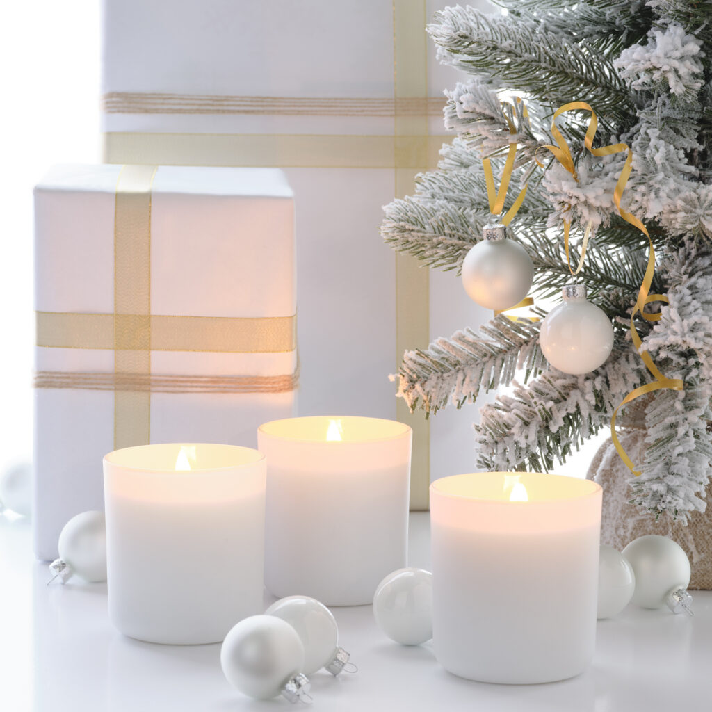 Cue Candle Company white candles in dreamy white holiday scene