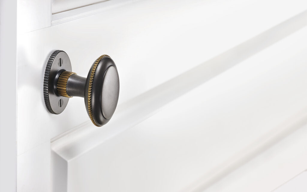Michael Coldren, Co. oval door hardware on white door