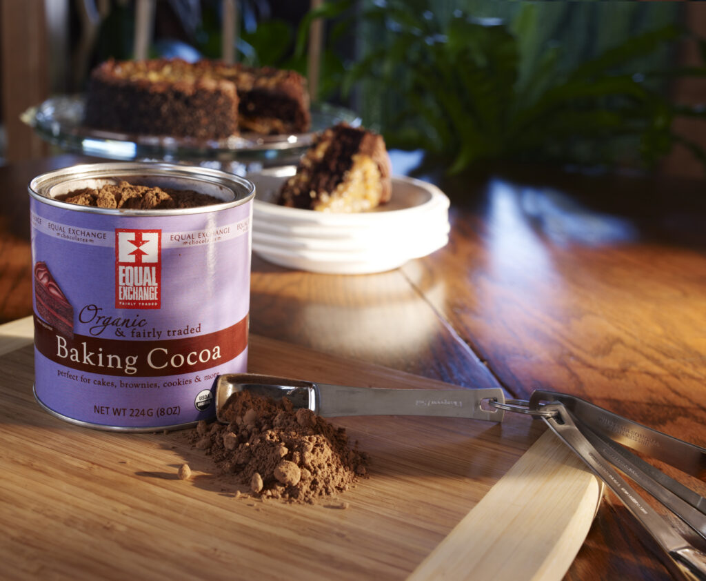 Equal Exchange cocoa powder with cake in background