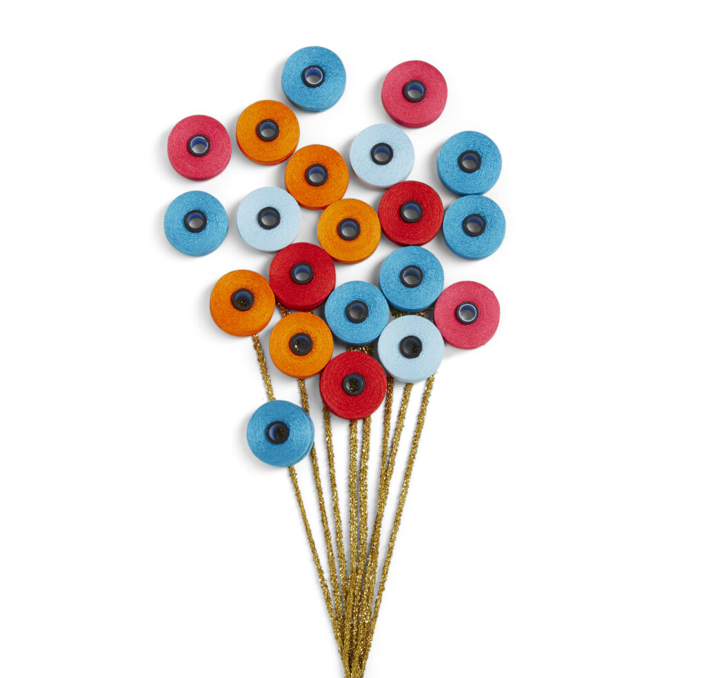 whimsical photo of bobbins arranged to look like baloons