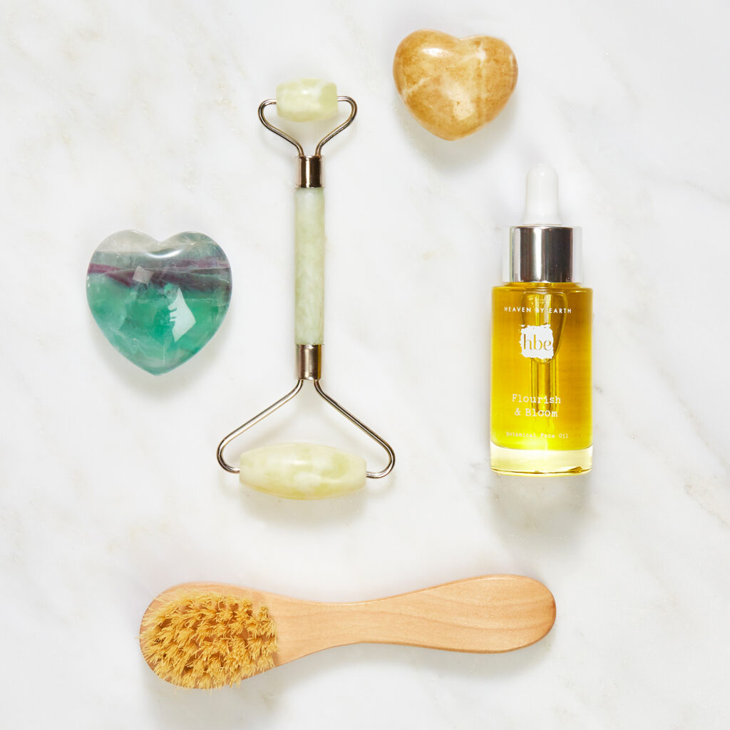 luxury beauty brand items on white marble