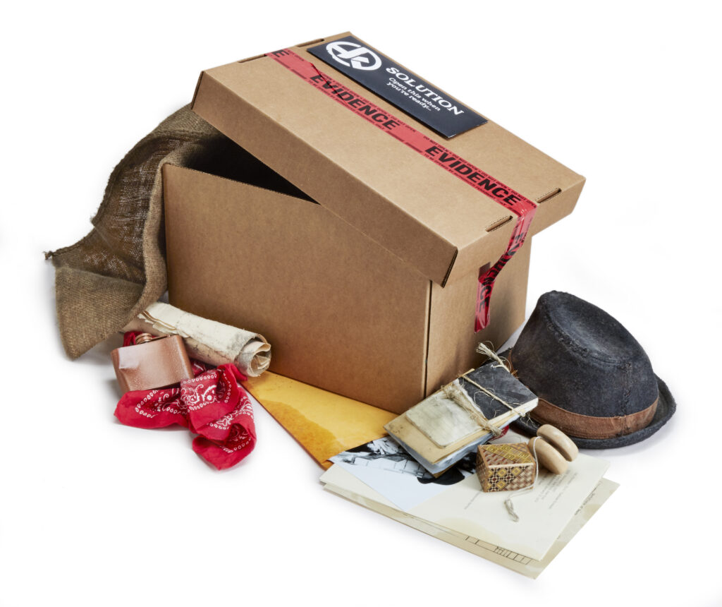 Hunt a Killer subscription box contents on white background