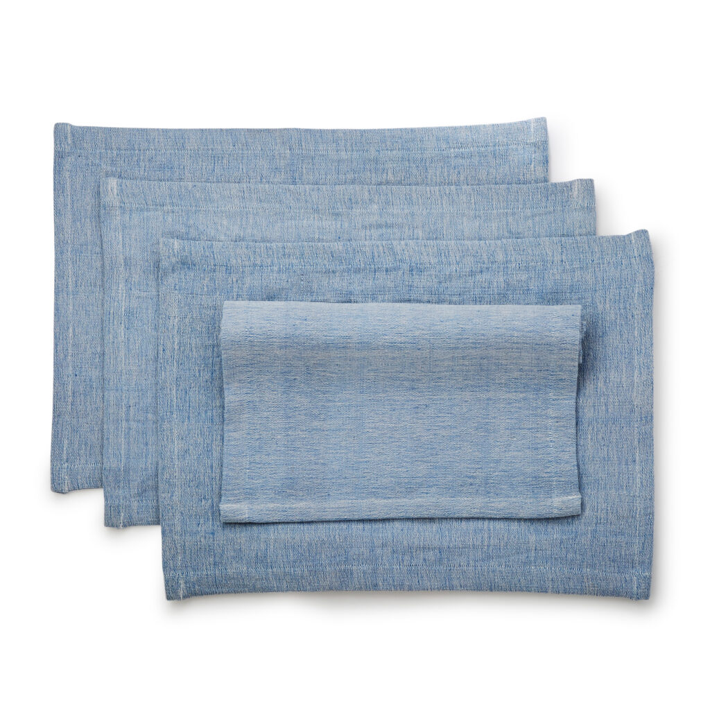Sustainable Threads fair trade handwoven handwoven blue placemat set on white background