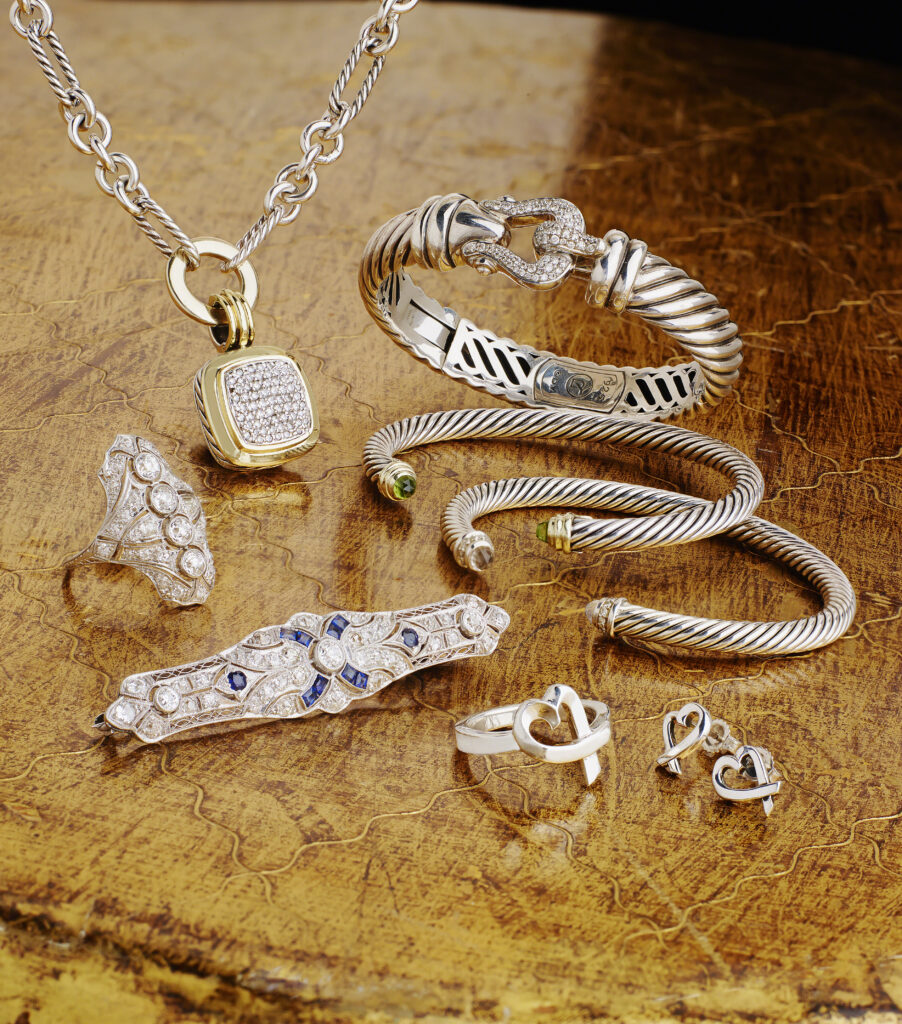 silver and gold estate jewelry on a gold background