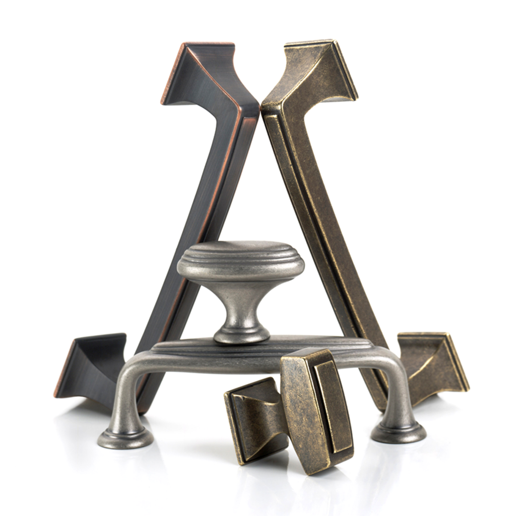 Amerock Mullholand oil rubbed bronze antique pewter and aged bronze hardware arranged as sculpture on white background