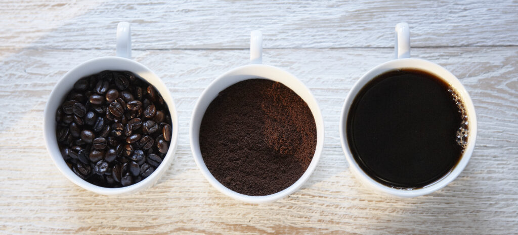 three white mugs with coffee shot from above