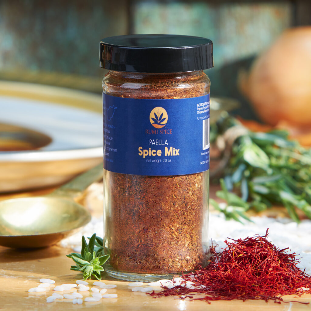 Rumi Spice jar of Paella Spice Mix with fresh botanicals