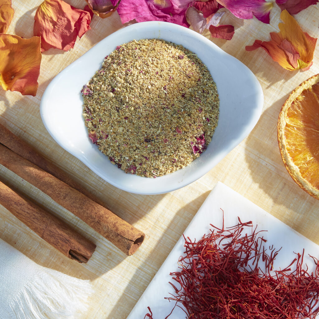saffron and blended spices in white vessels from above with scattered spices