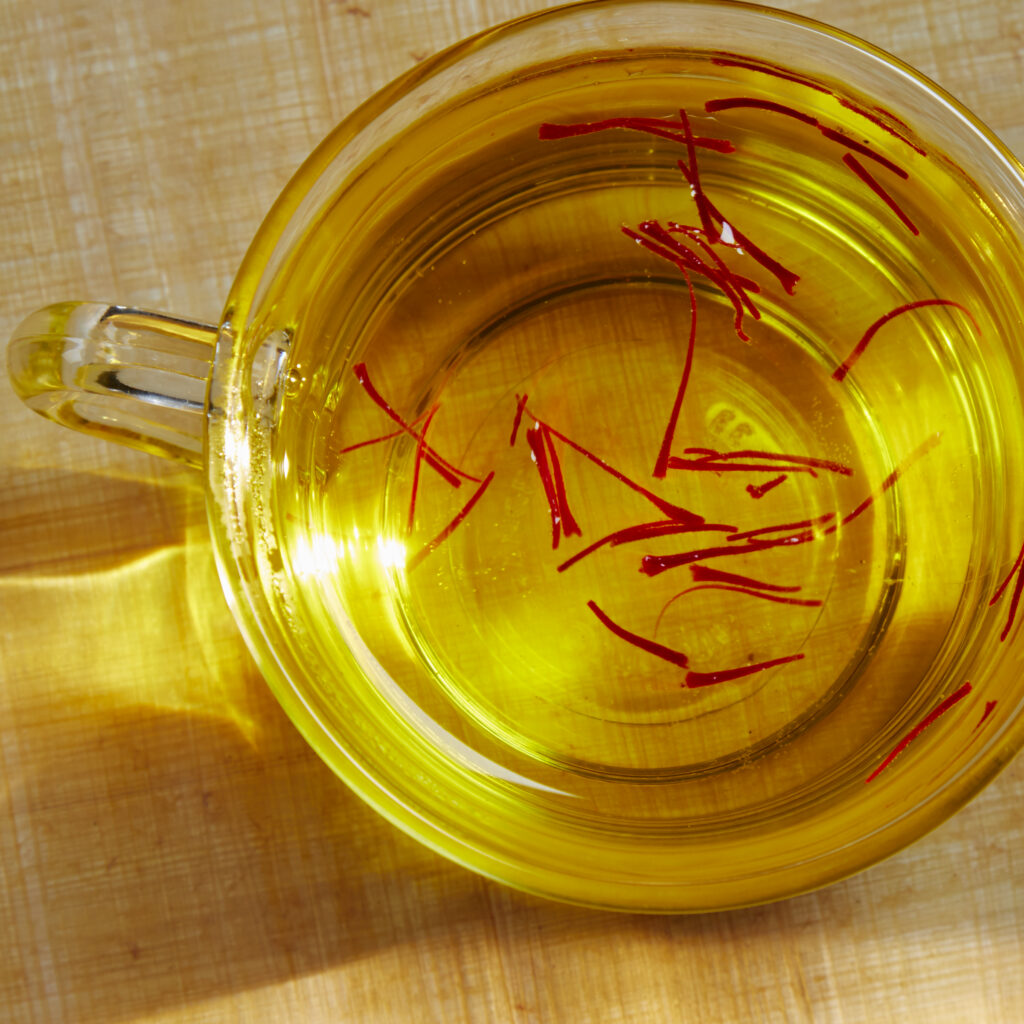 cup of saffron tea viewed from above with bright lighting