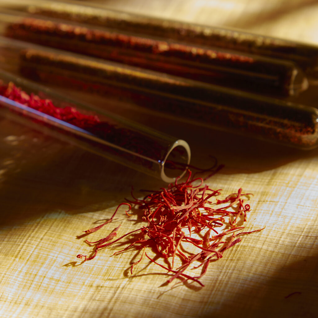 beautiful close up of saffron spilling from glass tube