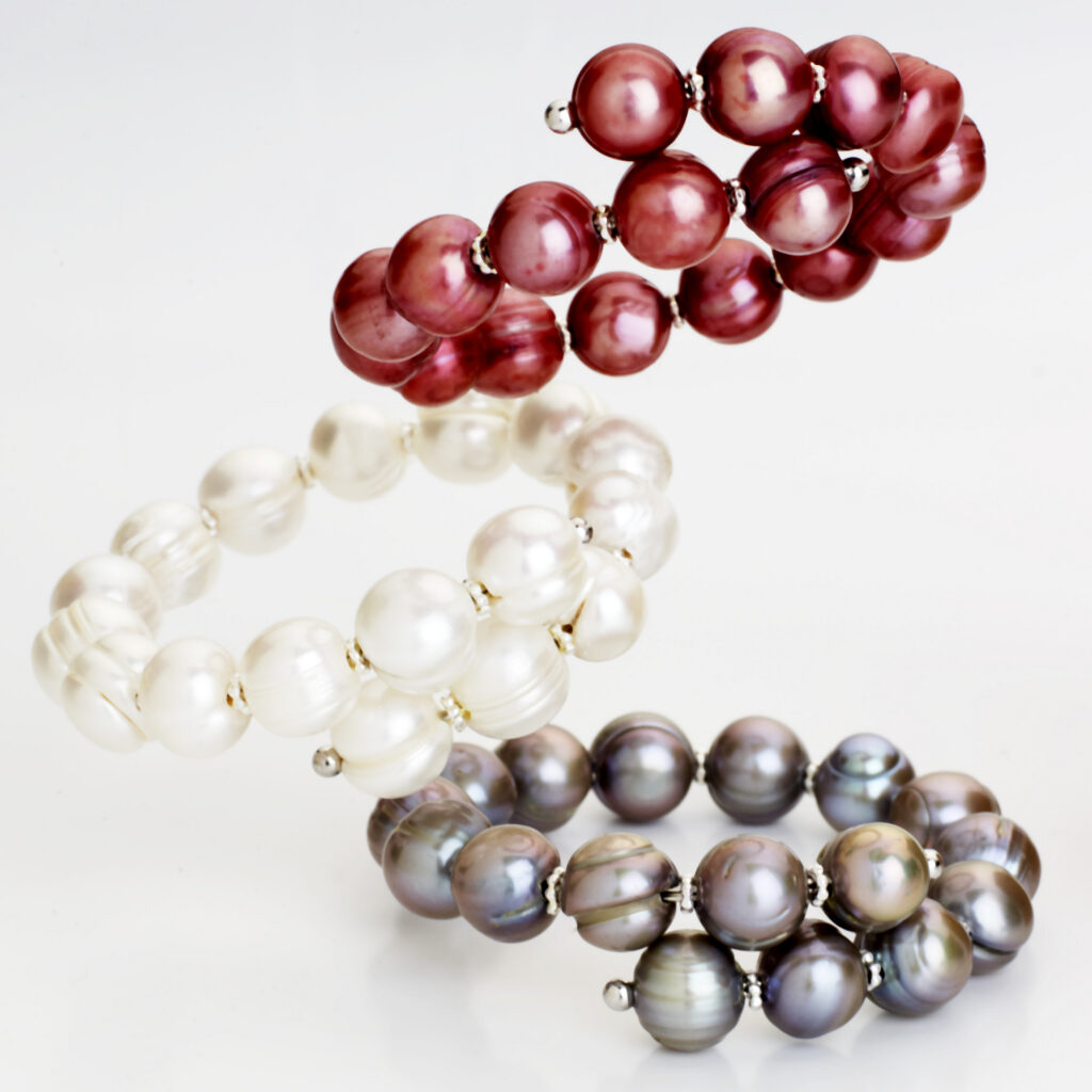 pearl bangle bracelets in a dramatic composition