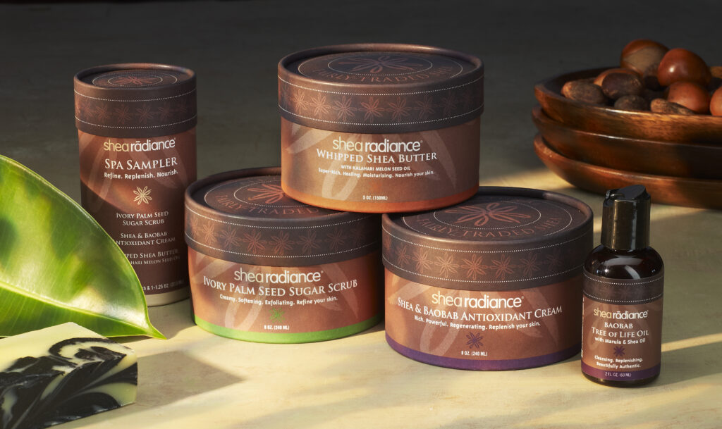 Shea Radiance beauty brand luxury packaging on earthy background
