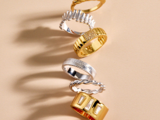 tumbling column of silver and gold rings with dramatic shadow