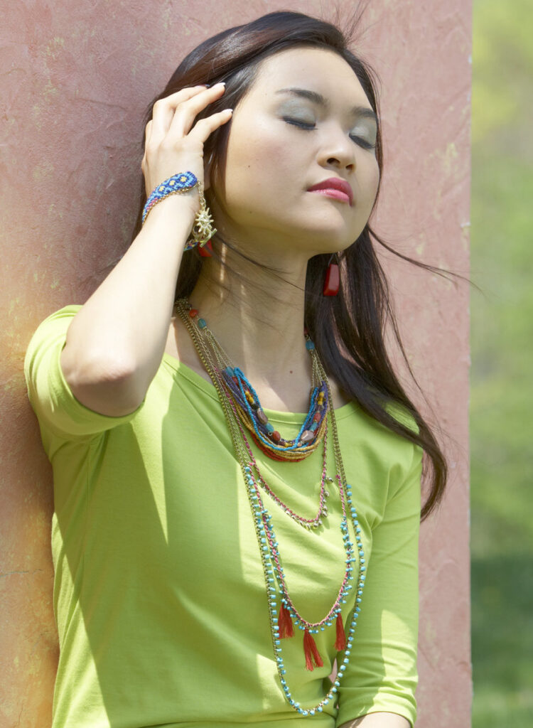 beautiful model wearing beaded fair trade jewelry