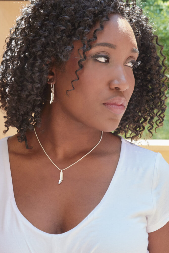 beautiful model wearing silver fair trade jewelry