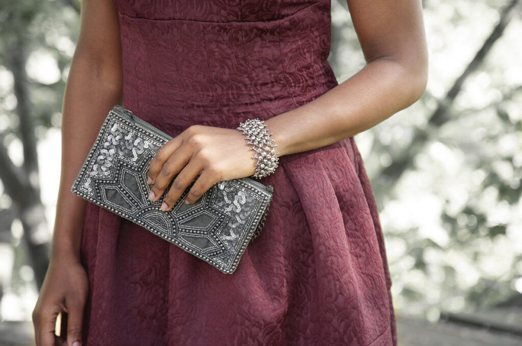beautiful model with handcrafted fair trade beaded bracelet and clutch