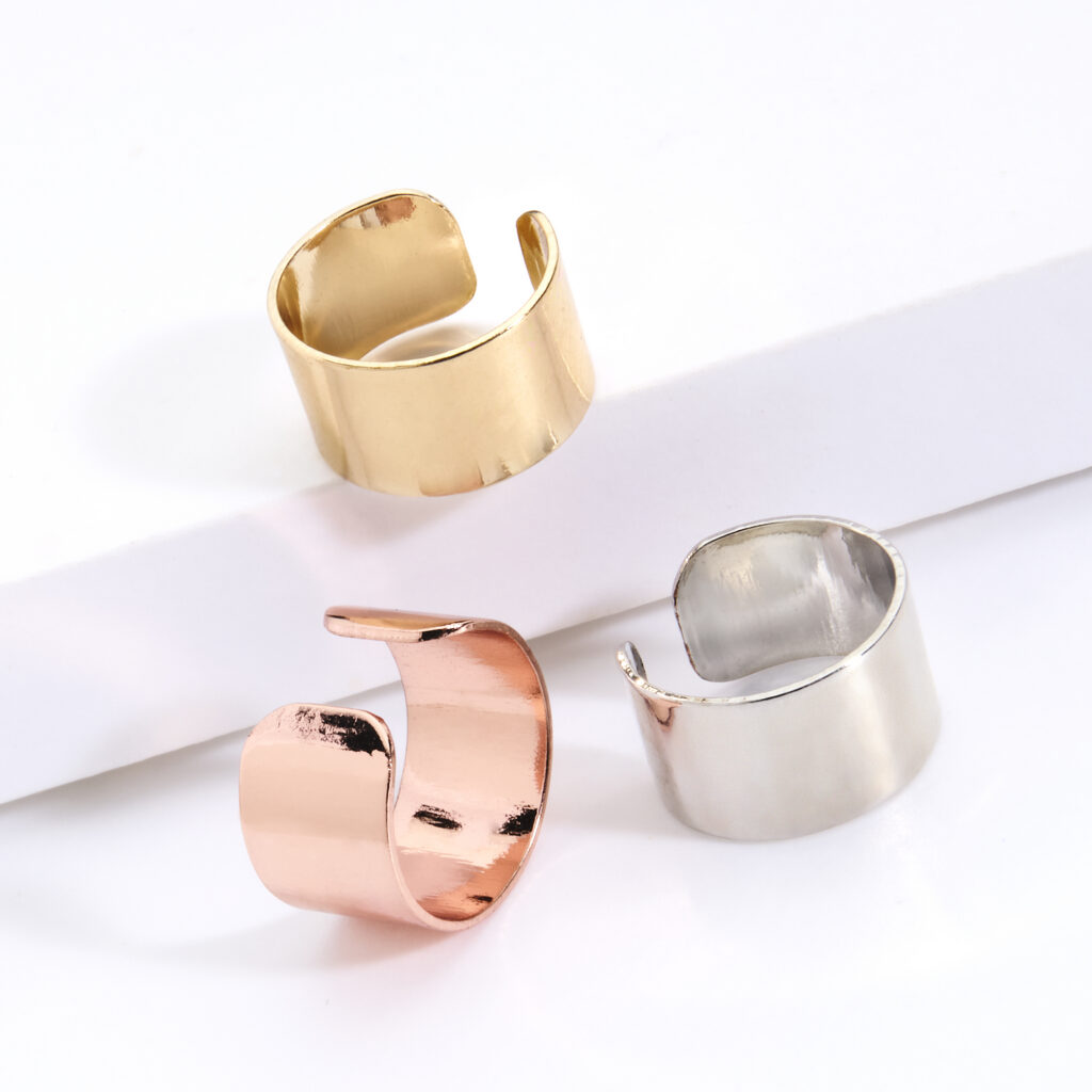 gold silver and rose gold ear cuffs on white background with soft lighting