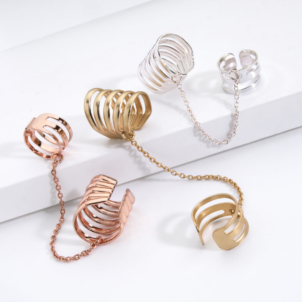 gold silver and rose gold ear cuffs on white background with soft lighting