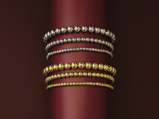dramatic dark red background showing bright beaded bracelets