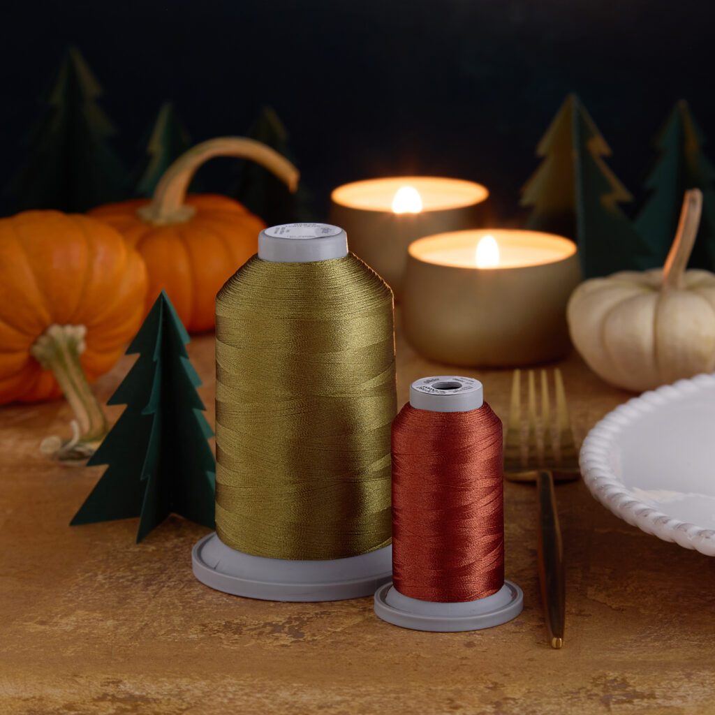 fall colored threads in thanksgiving setting with pumpkins