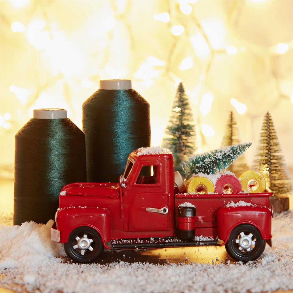 cute red toy truck with thread in Christmas scene