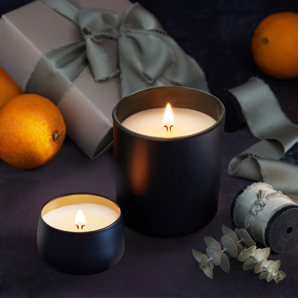 Cue Candle Company black jar candles with luxury gift and oranges