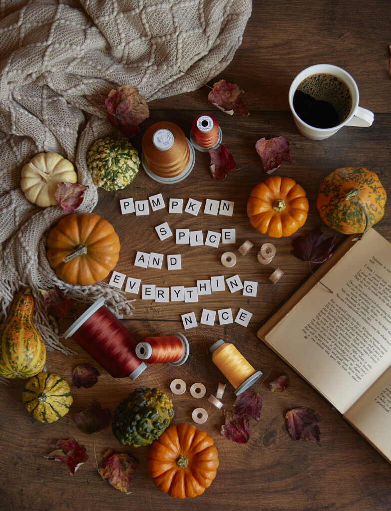 fall montage with threads, pumpkins and fall leaves spelling out pumpkins and spice and everything nice with letter tiles