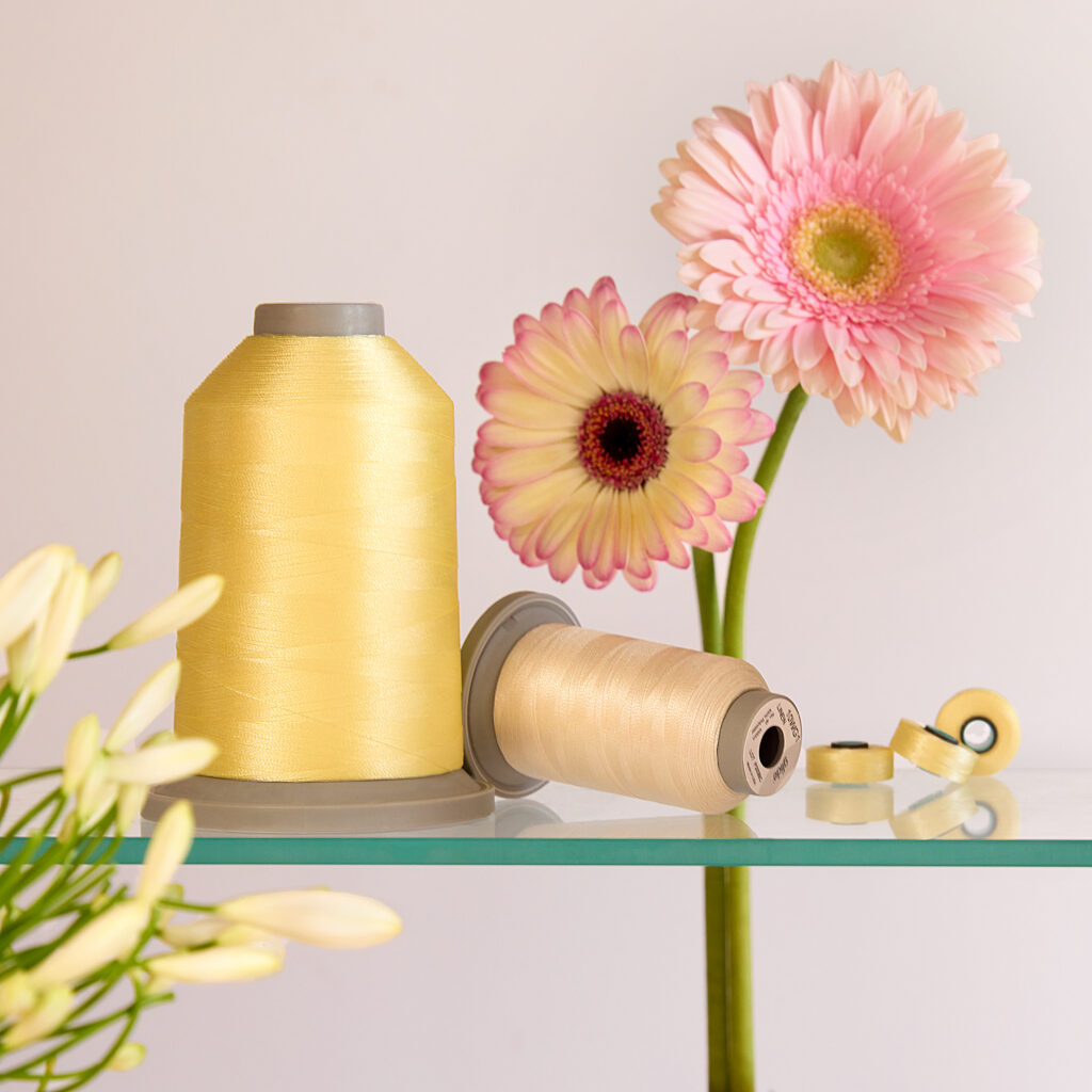 pale yellow thread with soft pink flowers
