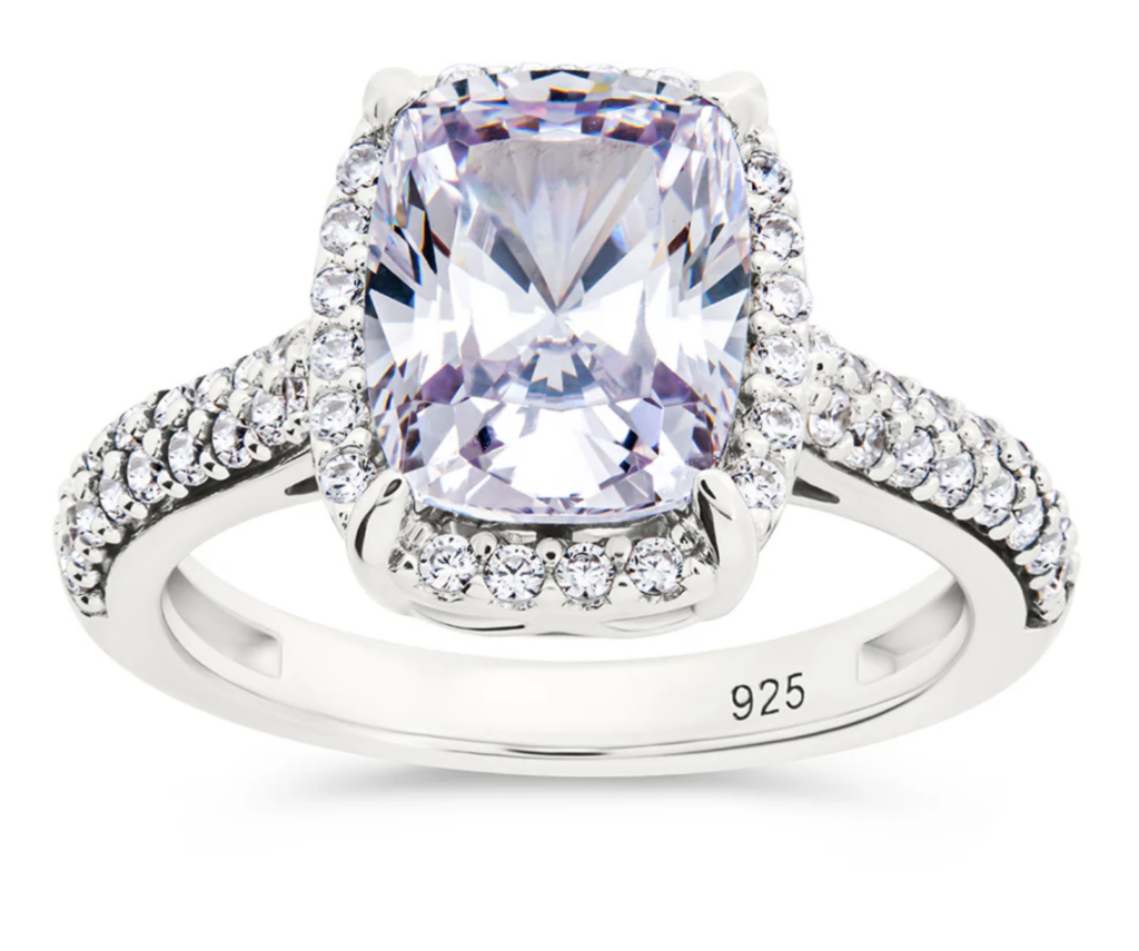 silver and amethyst cocktail ring on a white background